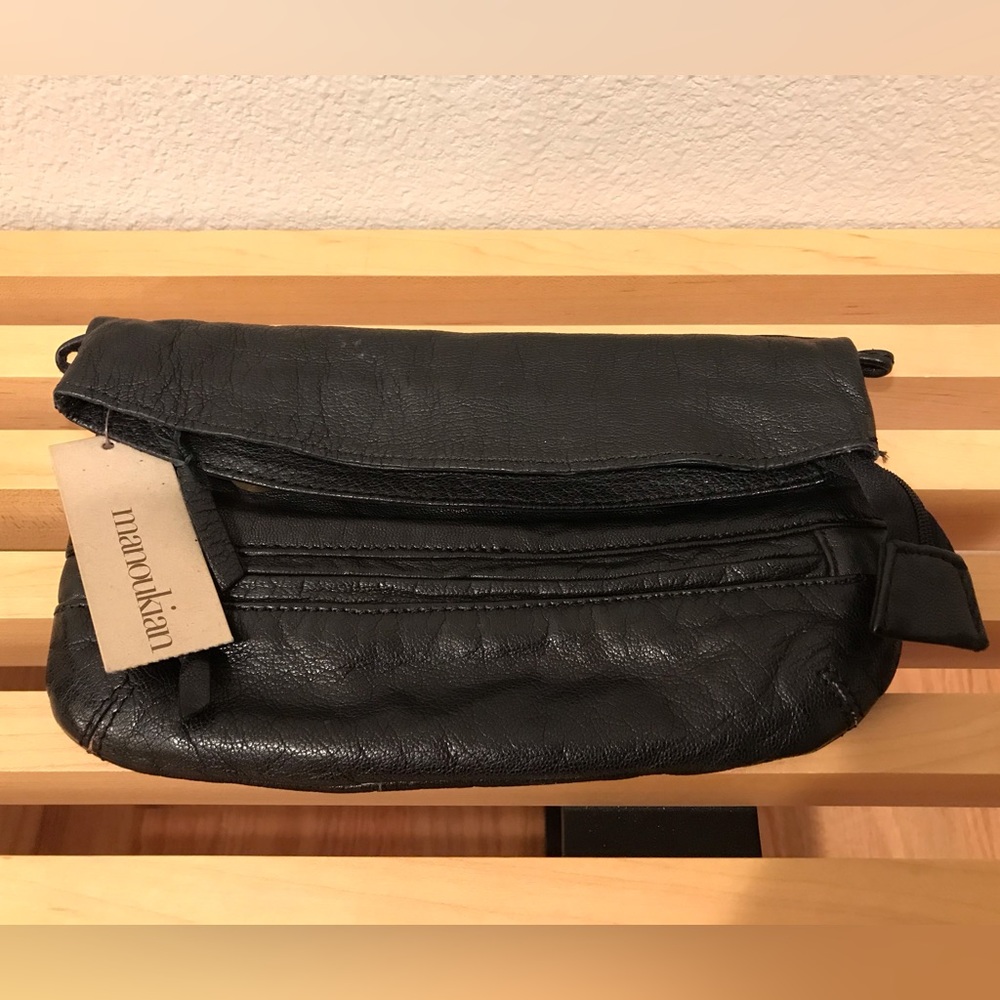 Manoukian black leather clutch